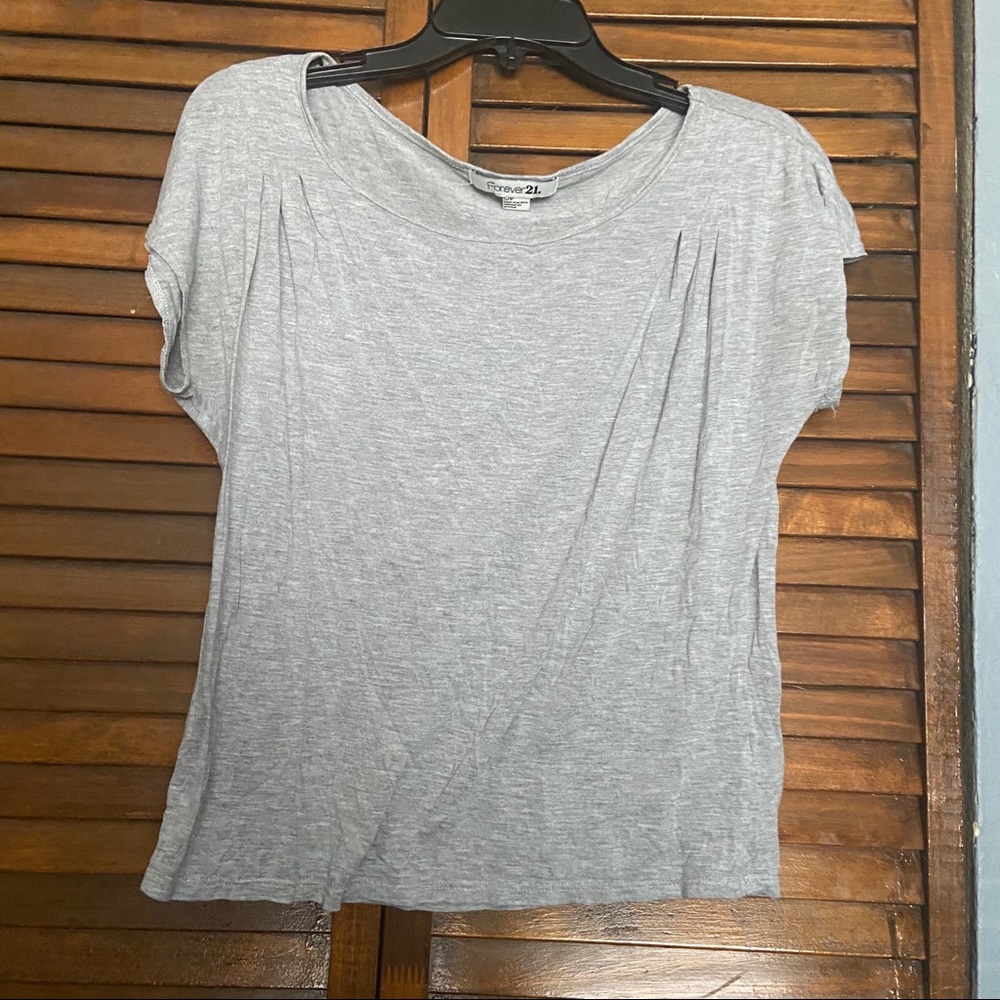 Light gray shirt .